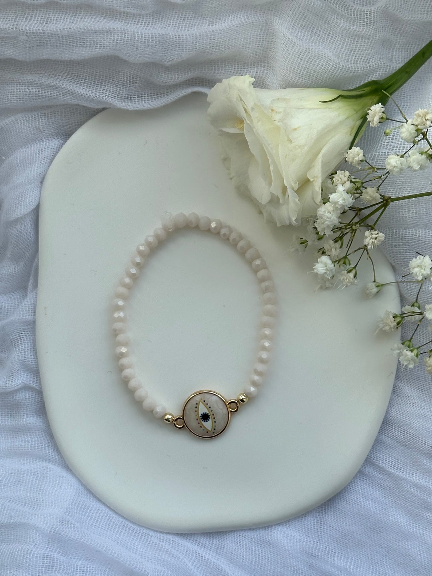 Perlenarmband mit Beigen Kristallperlen + Nazar Anhänger - 10550