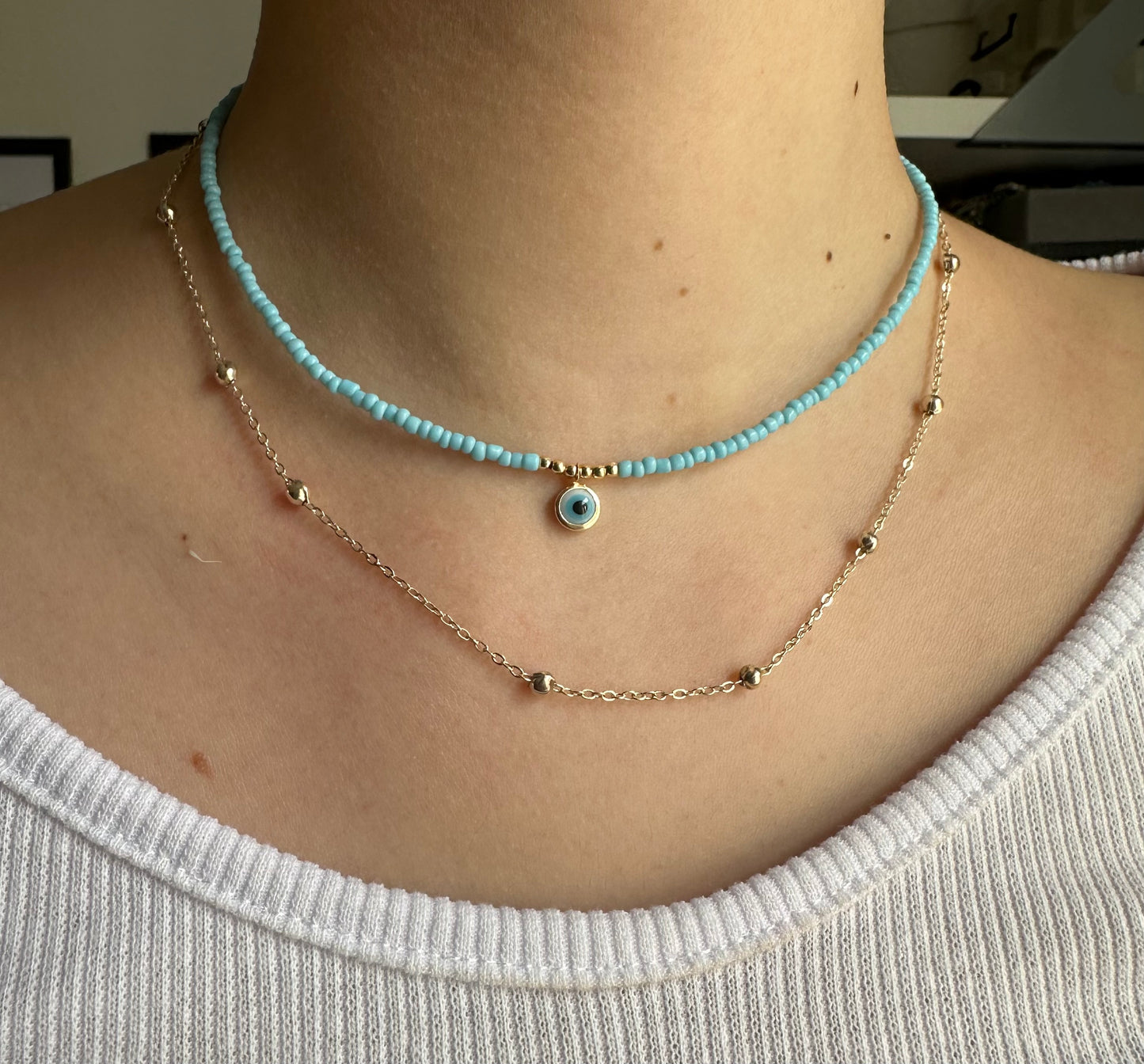 Perlenkette mit Hellblauen Perlen und Nazar - 10120