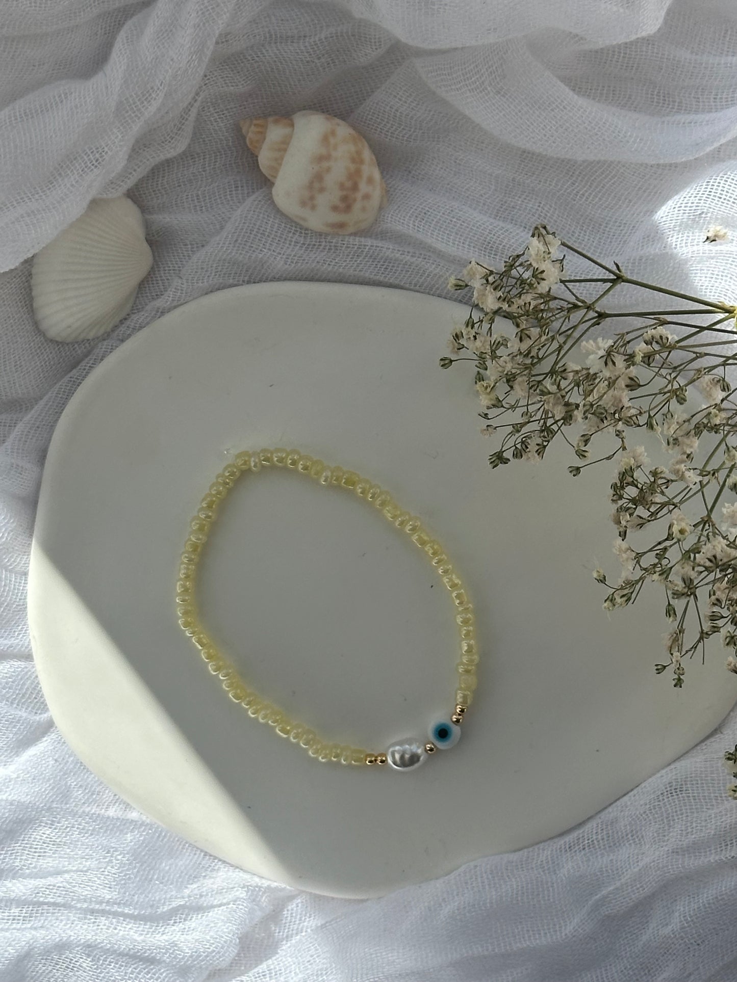 Perlenarmband mit Gelben Perlen und Goldenen Perlen + Nazar Anhänger - 10812