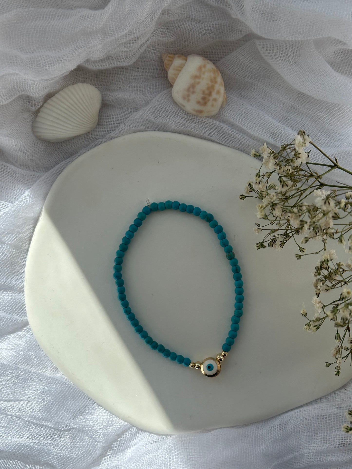 Perlenarmband mit Türkisen Perlen und Goldenen Perlen + Nazar Anhänger - 10845