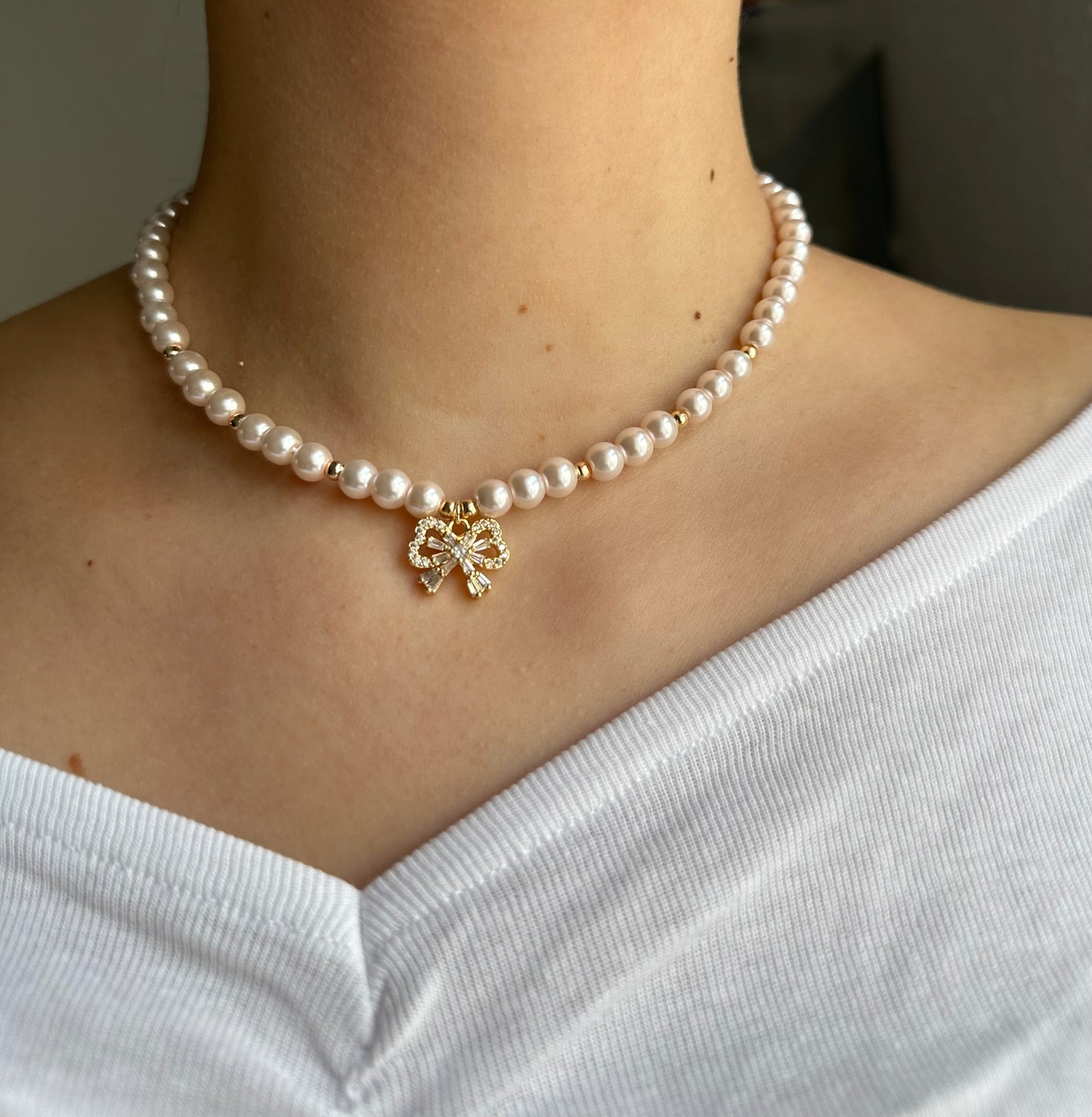 Perlenkette mit Rosa Perlen + Zirkonia Schleifen Anhänger - 10613
