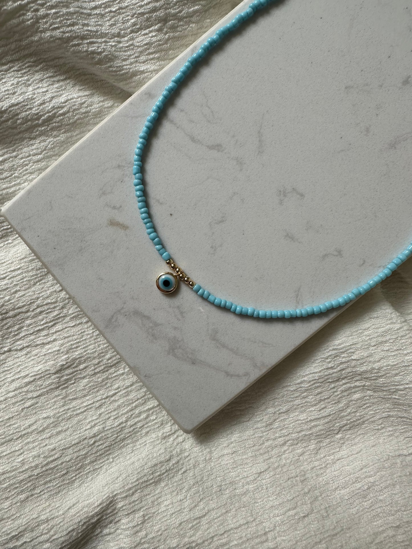 Perlenkette mit Hellblauen Perlen und Nazar - 10120