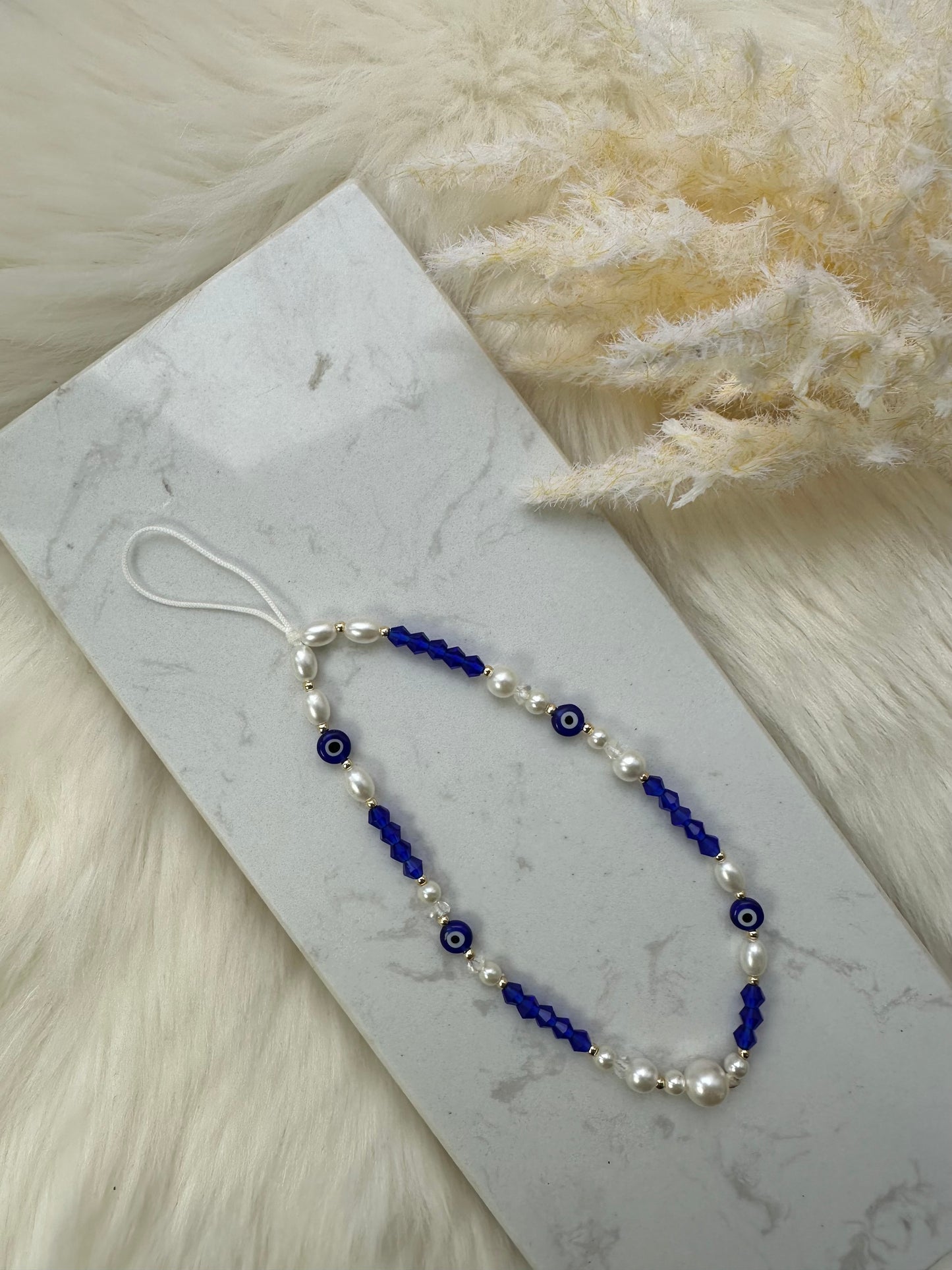 Handykette mit dunkelblauen Perlen und Nazar - 10077