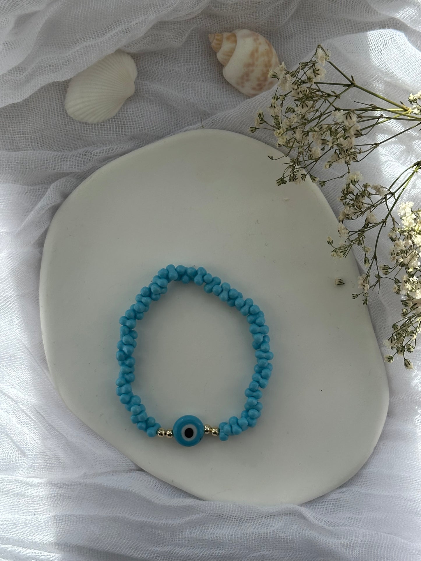 Perlenarmband mit Blauen Perlen und Goldenen Perlen + Nazar Anhänger - 10847