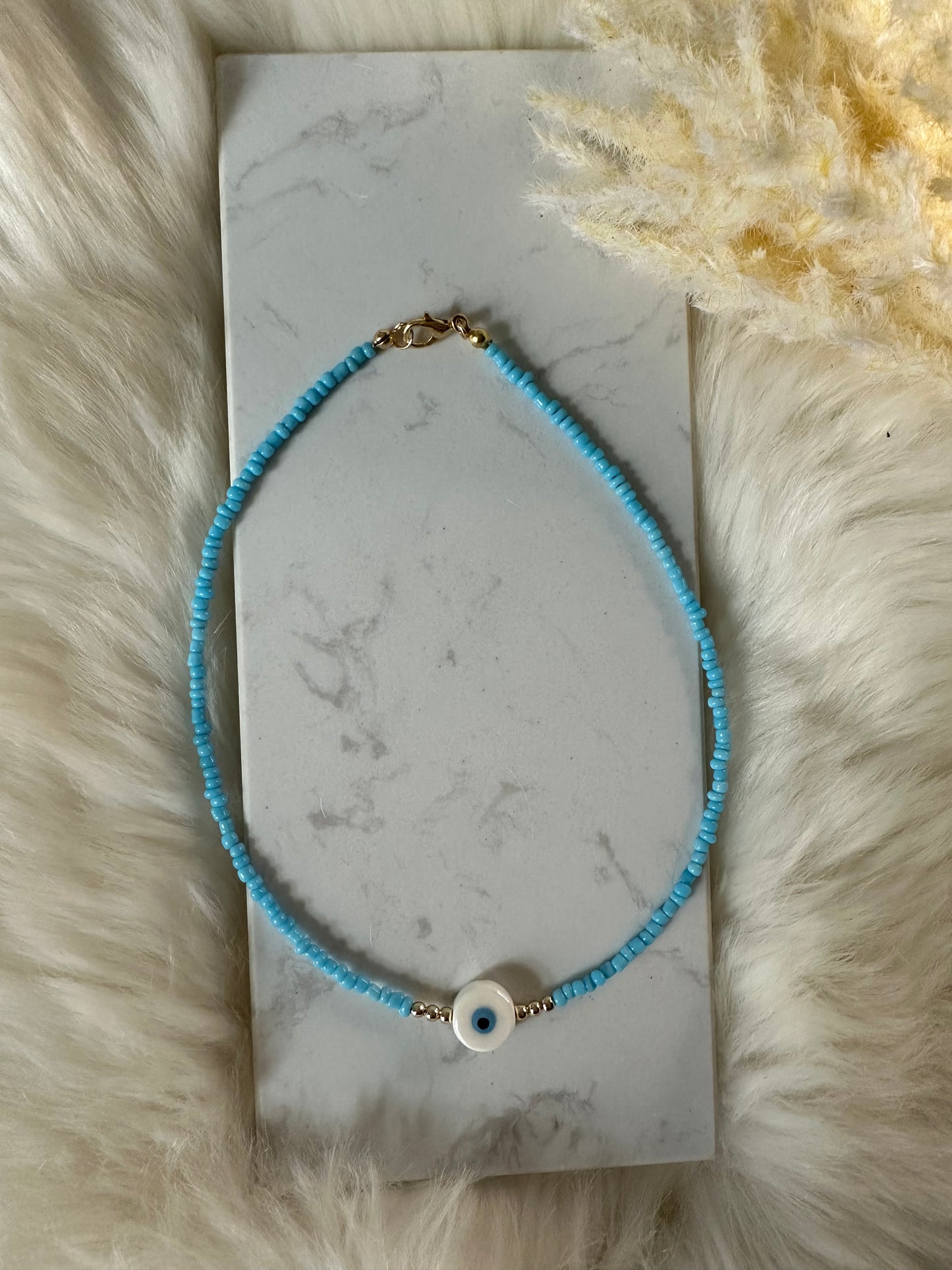 Perlenkette mit blauen Perlen und einer Nazar Perle - 10156