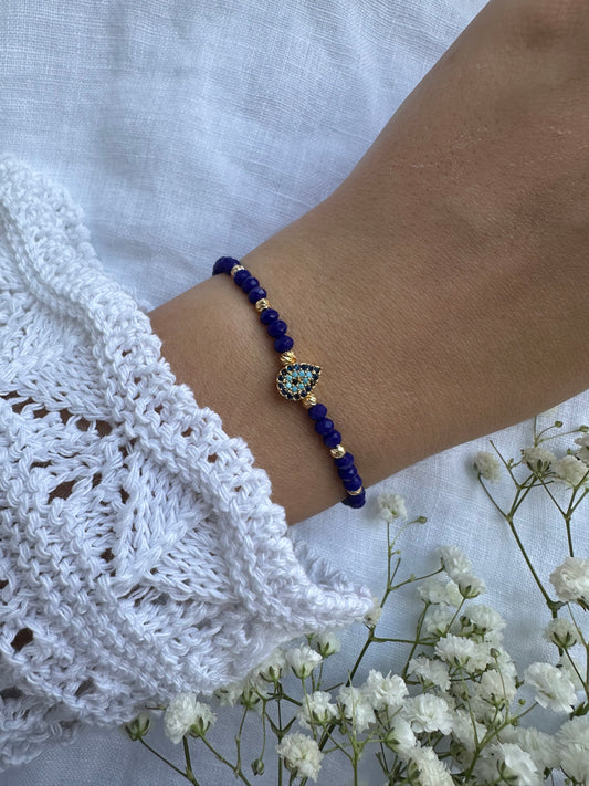 Perlenarmband mit Dunkelblauen Kristallperlen und Nazar Anhänger - 10422