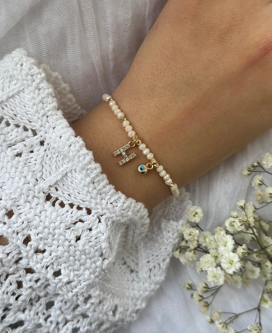 Perlenarmband personalisiert mit Beigen Kristallperlen und Nazar Anhänger - 10524
