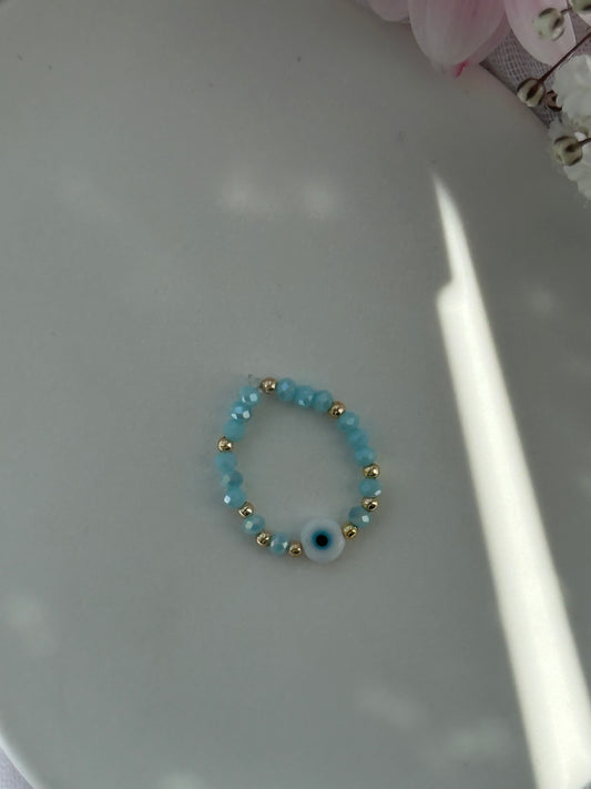 Perlenring mit Blauen Kristallperlen und goldenen Details + Nazar Anhänger - 10779