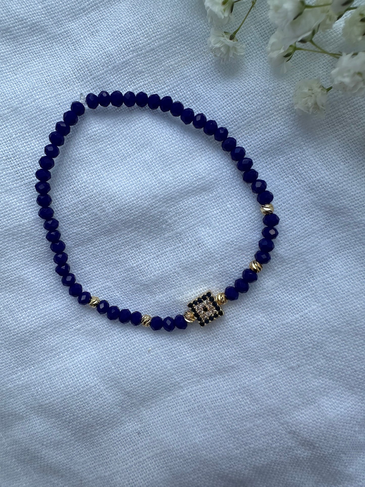 Perlenarmband mit Dunkelblauen Kristallperlen und Nazar Anhänger - 10314