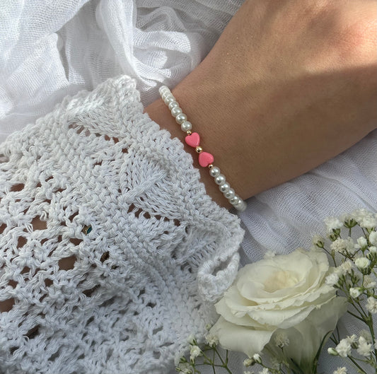 Perlenarmband mit Weißen Perlen und einer Pinken Schleife - 10537