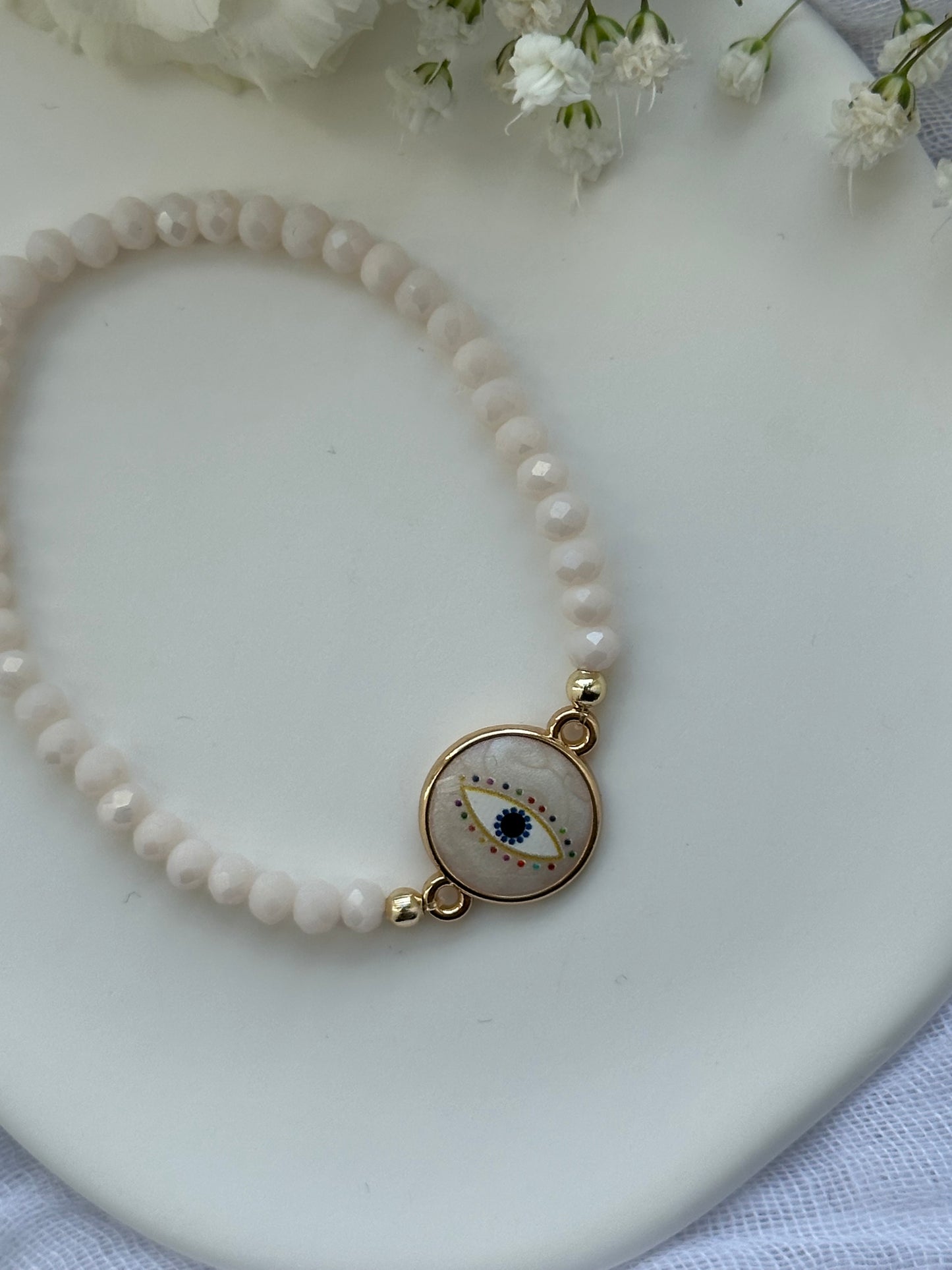 Perlenarmband mit Beigen Kristallperlen + Nazar Anhänger - 10550