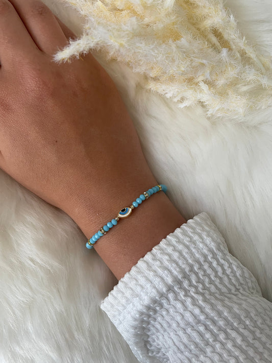 Perlenarmband mit blauen Perlen und Augen Anhänger - 10287